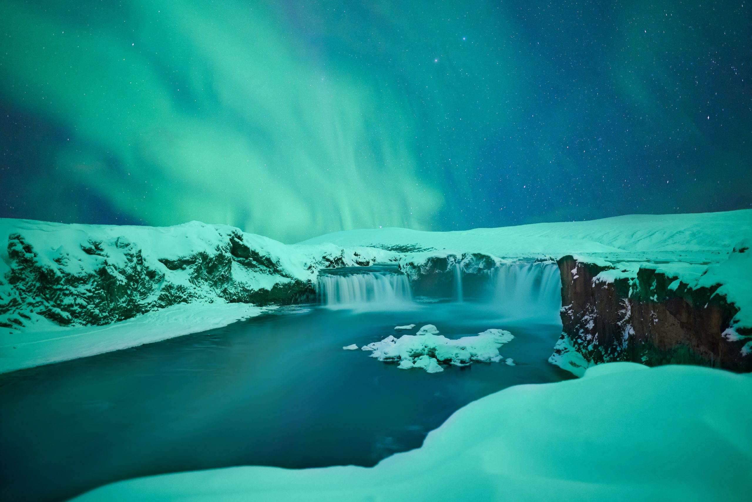 Auroras over Goðafoss waterfall, Iceland