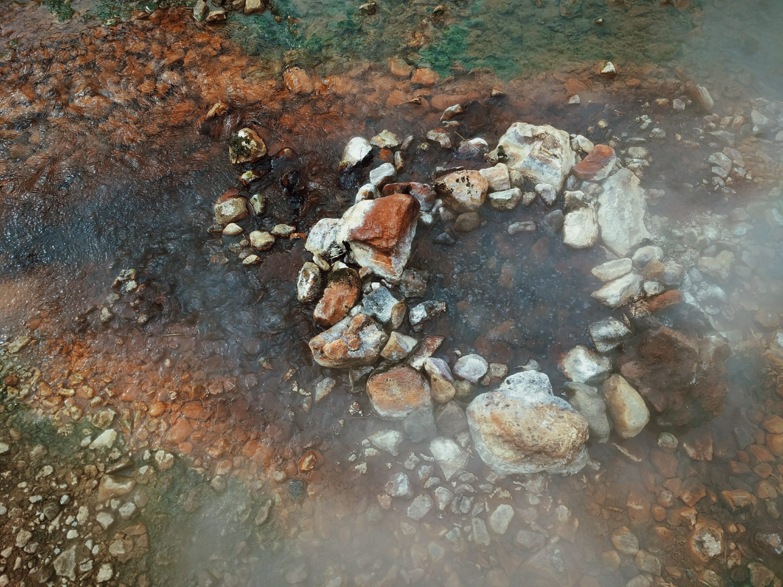 Colorful, steaming geothermal pool