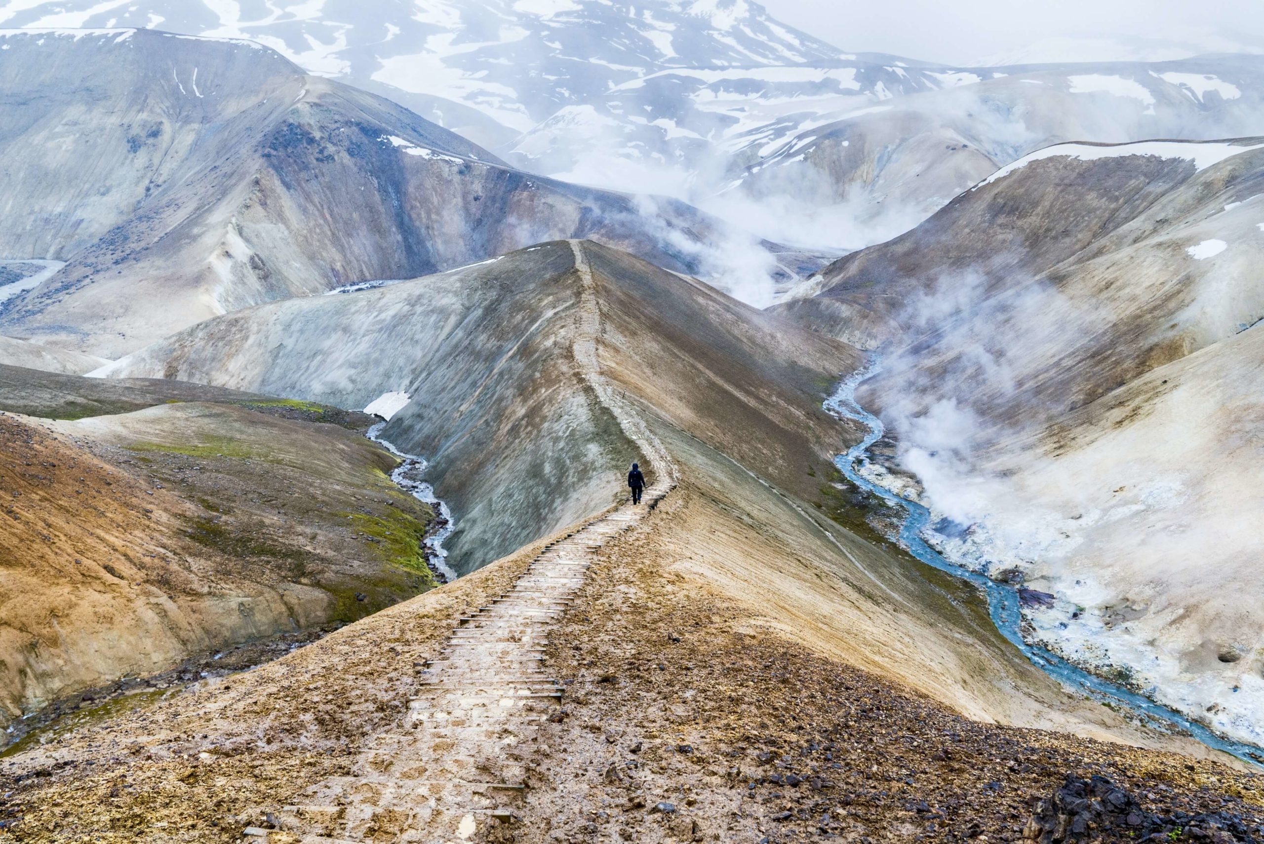 Man walking next to Kerlingarfjoll natural hot spring